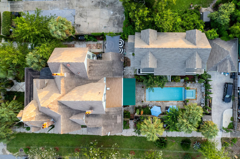 Top-down aerial showing pool, courtyard and rooflines