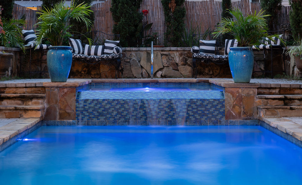 Pool waterfall feature with mosaic tile