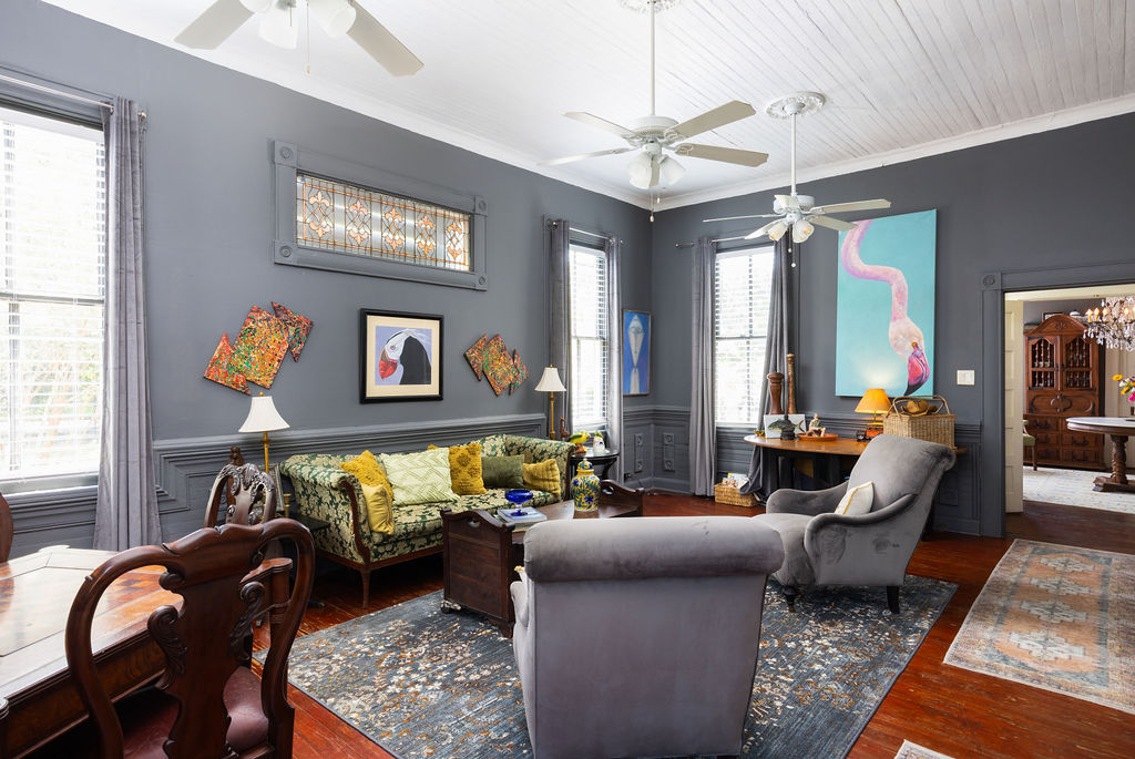 Sitting room with original hardwood and gallery wall